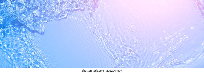 Serum texture close up. Light blue and pink gradient liquid gel background. Transparent beauty skincare sample. Cosmetic clear liquid cream smudge. Long banner with copy space - Shutterstock ID 2022244679