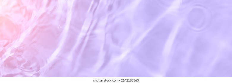 Serum water texture close up  Light purple   pink gradient liquid gel background  Transparent beauty skincare sample  Cosmetic clear liquid cream smudge  Long banner and copy space 