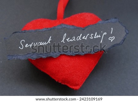 Servant leadership - heart and note with handwriting text