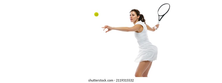 Serve In Tennis. Dynamic Portrait Of Young Sportive Woman, Tennis Player Practicing Isolated On White Background. Healthy Lifestyle, Fitness, Sport, Exercise Concept. Female Athlete In Motion, Action