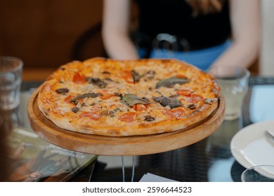 The served dinner table with pizza