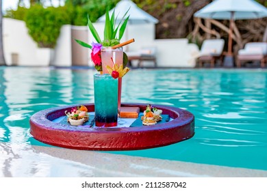 Served Floating Tray In Swimming Pool With Drinks And Snacks On Tropical Island Resort In Maldives, Cocktails And Canapes For Romantic Date Or Honeymoon In Luxury Hotel, Travel Concept