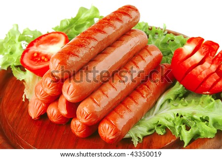 served grilled beef red sausages on wooden plate