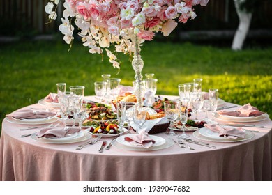 Served Outdoor Banquet Table With Assorted Oriental Appetizers