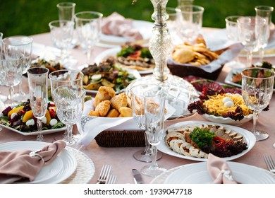 Served outdoor banquet table with assorted oriental appetizers