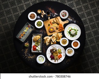 Served Round Table, Turkish And Buckwheat Dishes Served Table Top View. Black Background.