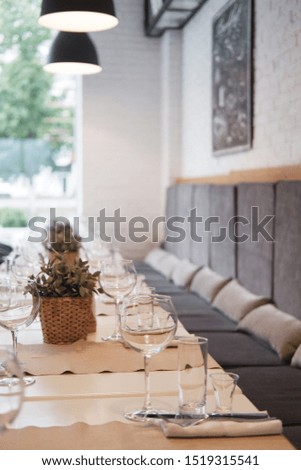 served table in a cafe, empty glasses, perspective, interior in a cafe