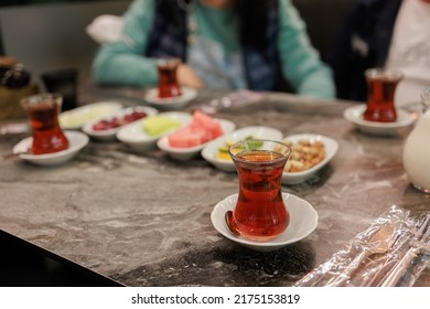 Served table with different dishes and snacks, fruits, vegetables and cheeses.