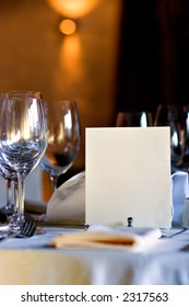 Served Table In Restaurant Interior, With Blank Menu, With Copy Space