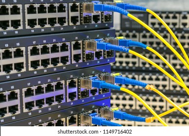 Server communication equipment of the Internet provider. Fiber-optic cables are connected to the switch ports. High-speed data transfer. - Shutterstock ID 1149716402