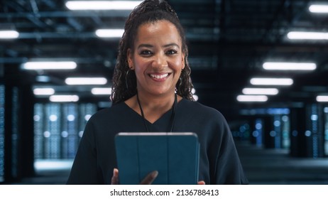 Server Farm Cloud. Computing Specialist Facility with Multiethnic Female System Administrator Working with Data Protection Network for Cyber Security. Data Center Engineer Using Tablet Computer.
