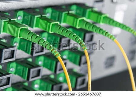 server with fiber optic  cables in data center