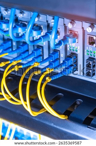 server with fiber optic cables  and network cable in data center