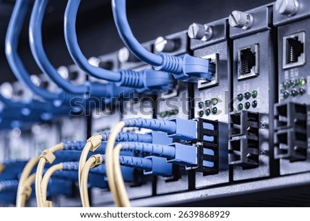 server with fiber optic cables  and network cable in data center