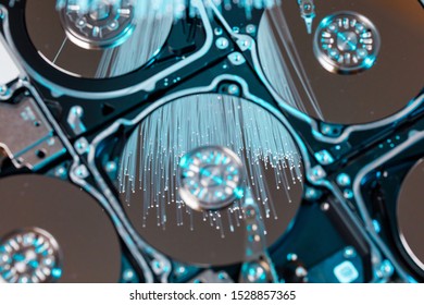 Server hard disks, illuminated optical fiber with blurred lights.