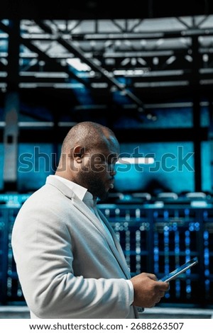 Server hub admin checking recovery plan on tablet, tracking resource utilization trends. Data center IT expert scanning hardware logs for faults, making sure rigs are functioning optimally