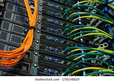 Server internet datacenter room, network. Fiber connectivity. Data center. Color cables installed in the rack. Array disk storage in data center.