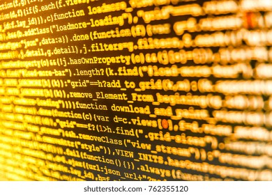 Server logs analysis. IT business.  Coding script text on screen. Desktop PC monitor photo. Programmer occupation job. Web site codes on computer monitor. Coworkers team in modern office. 