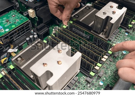 Server maintenance and hardware installation - technician work on a modern mainboard