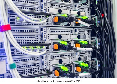 Server network interfaces and electrical wires are close-up. Powerful computer equipment is installed in the datacenter racks