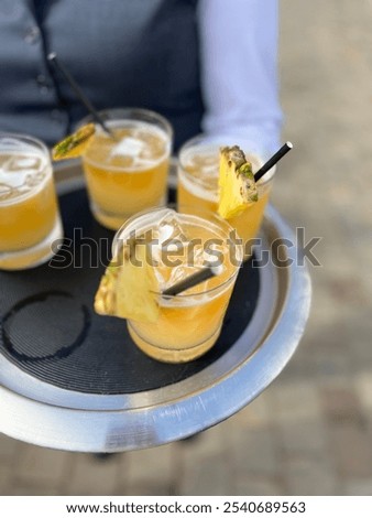 Server Offers Multiple Drinks on Tray