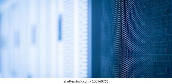 Server rack cluster in a data center (shallow DOF; color toned image)