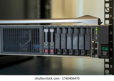 Server rack cluster in a data center. Communication and internet network server room.