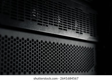 Server rack front grille. Computer network server black metal chassis exterior.