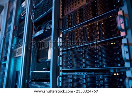 Server rack with supercomputer hardware in big data center inside closeup