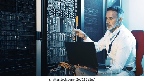 Server room, programmer and man with laptop, hardware problem solving and network inspection. IT specialist, mature person and employee with pc, cyber security and tech upgrade with maintenance