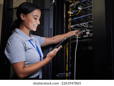 Server room, tablet and engineer woman with connection cable for maintenance or software update at night. Cybersecurity, it programmer or female with technology for database networking in data center - Powered by Shutterstock