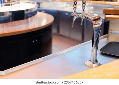 Servers pouring draft beer at table