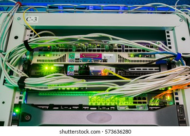 Servers and switches operating in a rack of server room - Powered by Shutterstock - Get 15% off with code: PIKWIZARD15