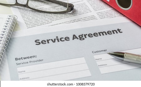 A Service Agreement With A Pen On A Desk