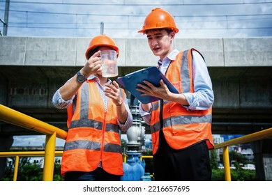 Service Engineer  Checking On Waste Water Treatment Plant With Pump On Background. Worker  Working On Waste Water Plant.