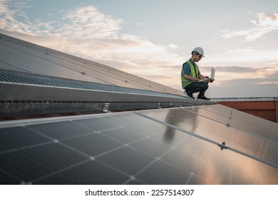 Service engineer checking solar cell on the roof for maintenance if there is a damaged part. Engineer worker install solar panel. Clean energy concept.