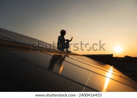 Service engineer checking solar cell on the roof for maintenance if there is a damaged part. Engineer worker install solar panel. Clean energy concept.