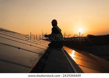 Service engineer checking solar cell on the roof for maintenance if there is a damaged part. Engineer worker install solar panel. Clean energy concept.