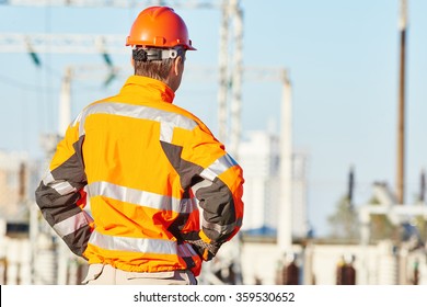 Service engineer standing at heat electropower station