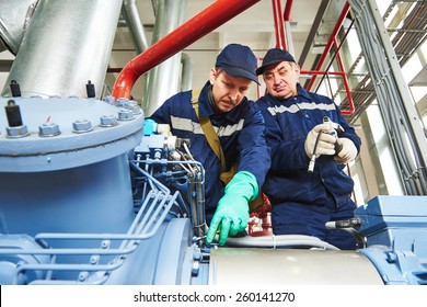 Service Engineer Worker At Industrial Compressor Refrigeration Station Repairing And Adjusting Equipment At Manufacturing Factory