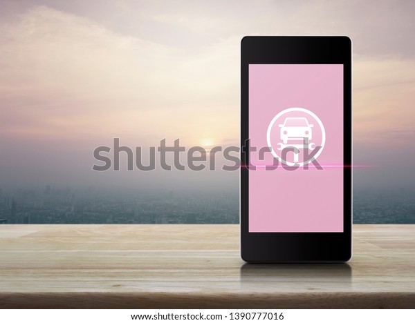 Service fix car\
with wrench tool icon on modern smart mobile phone screen on wooden\
table over city tower and skyscraper at sunset, vintage style,\
Business repair car online\
concept