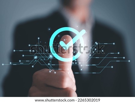 service guarantee, Validation concept for business process automation, quality assurance management, certification, digital transformation. businessman touching checked icon on virtual screen.