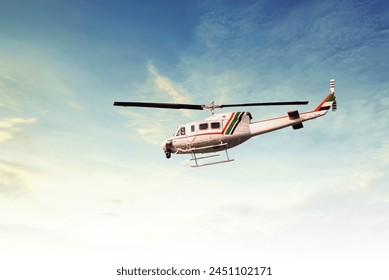 Service helicopter flying in the evening- UAE - Powered by Shutterstock