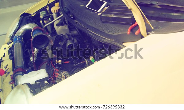 Service industry to repairing the China mini\
size car and tool, Photo retro color and little blur has copy space\
for background.
