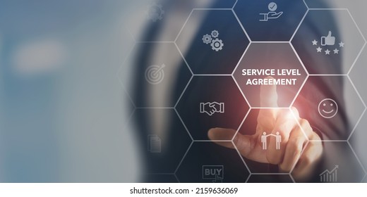 Service Level Agreement (SLA), business concept. Service performance tracking to reduce the uncertainty the customer in process. Businessman touching on SLA with smart screen background. - Shutterstock ID 2159636069