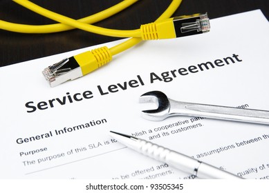 Service Level Agreement With Wrench, Pen And Lan Cable