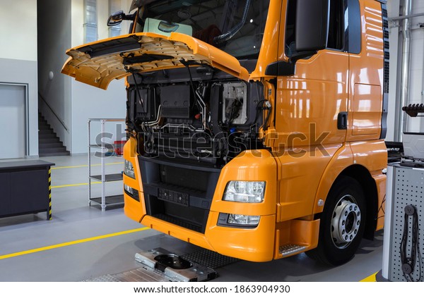 Service\
maintenance of trucks. Truck under repair at a service station. Car\
repair and inspection, car service,\
diagnostics