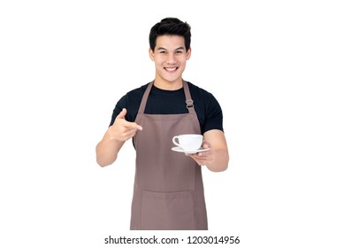 Service minded handsome smiling Asian barista serving coffee studio shot isolated on white background