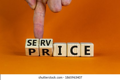 Service price symbol. Hand turns a cube and changes the words 'service' to 'price'. Beautiful orange background. Business and service price concept. Copy space.