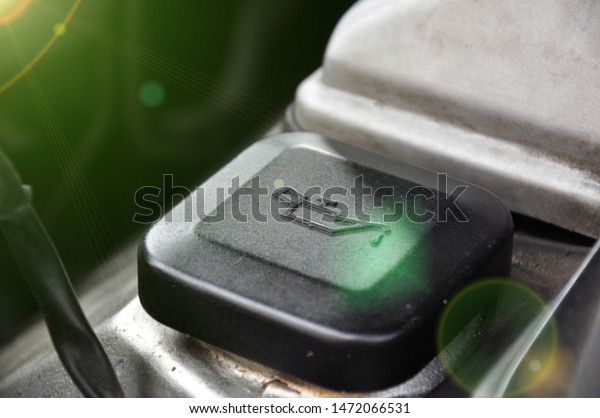 Service\
and Repair. Motor oil cap under the hood of a\
car